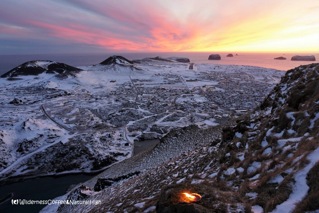 New Year's Eve candle & sunset Candle & sunset on Heimaklettur, Vestmannaeyjar, Iceland.