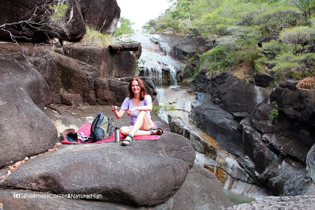 Enjoying a Wilderness Coffee at Mulligan Falls. Hinchinbrook Island, Queensland, Australia.
