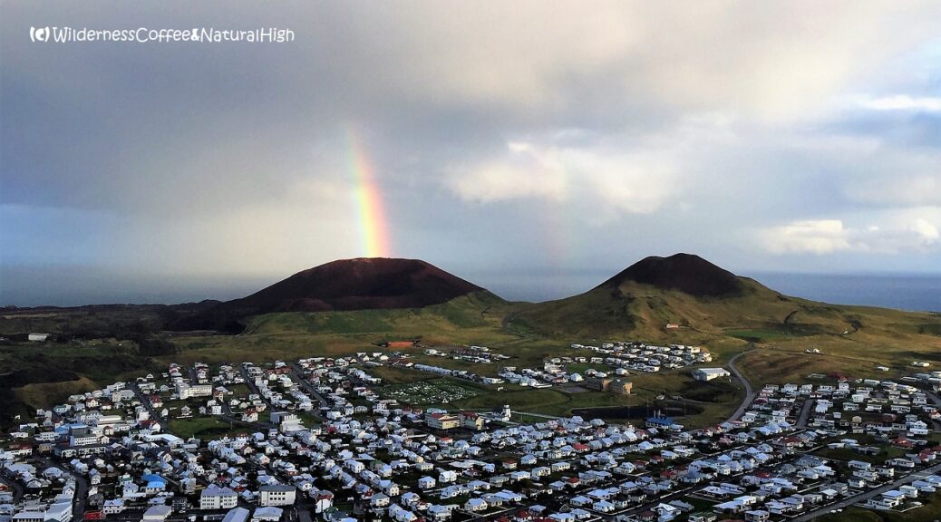 Eldfell volcano erupting a rainbow, Heimaey, Vestmannaeyjar, Iceland.