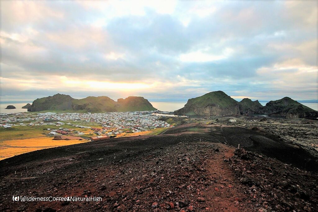 Midnight sunset and view from Eldfell Midnight sunset view from Eldfell, Vestmannaeyjar, Iceland.