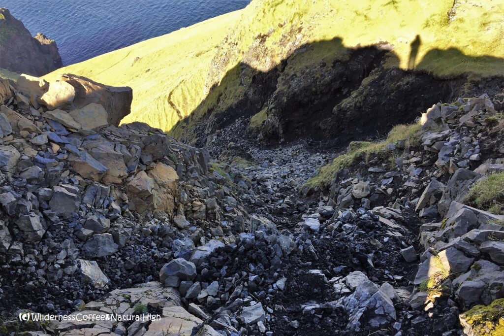 Steep bumslide section Blátindur hike, Heimaey, Vestmannaeyjar, Iceland.