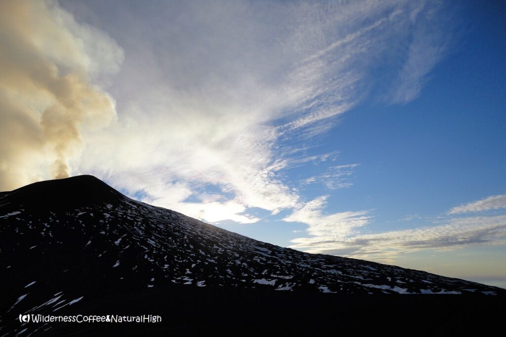 Steam and wispy clouds above Etna, Sicily, Italy.