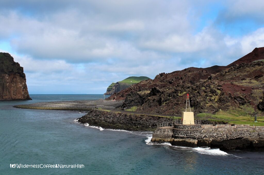 Heimaey harbour and Eldfell volcano lava field, Vestmannaeyjar, Iceland.