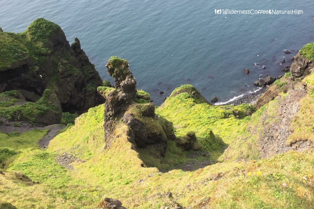 Cliffy coast and jumbled rocks, Herjólfsdalur, Heimaey, Vestmannaeyjar, Iceland.