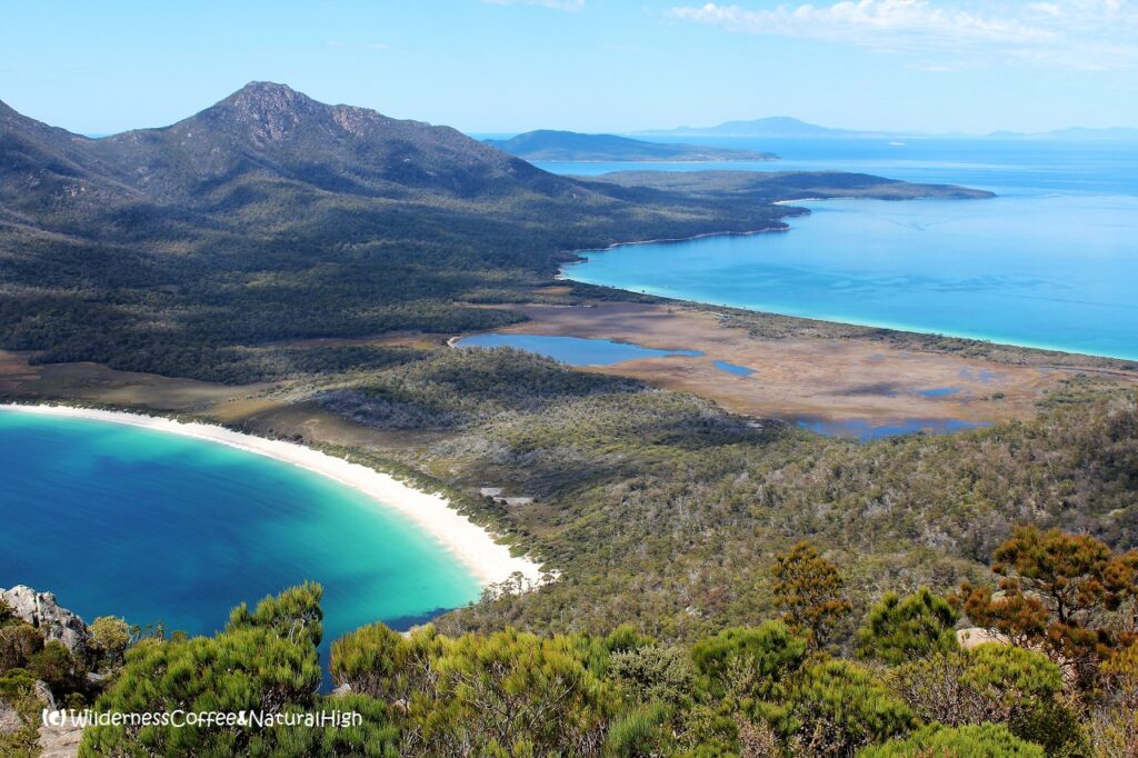 Looking out over Wineglass Bay from the top of Mount Amos View to Wineglass Bay from Mount Amos, The Hazards, Tasmania, Australia.