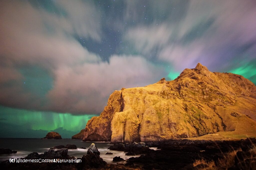 Northern lights above Blátindur Northern lights above Blátindur, Vestmannaeyjar, Iceland.
