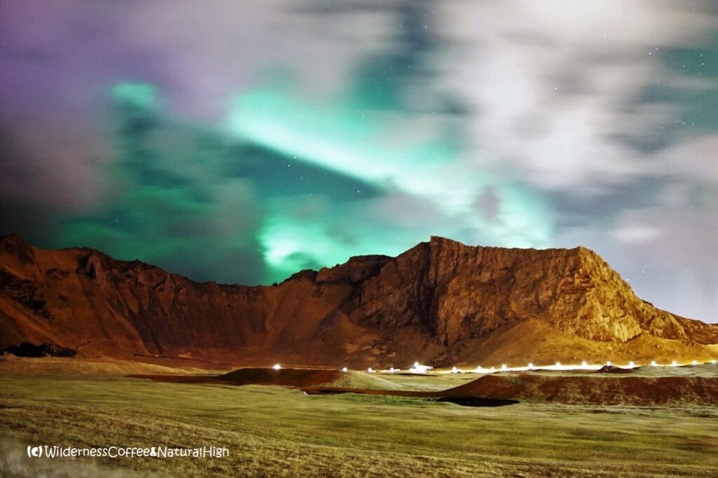 Northern lights above Herjólfsdalur. Heimaey, Vestmannaeyjar, Iceland.