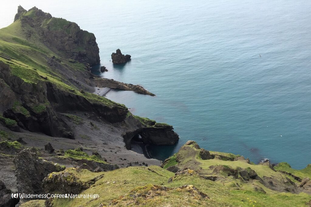 Sea cave and beaches, Dalfjall, Heimaey, Vestmannaeyjar, Iceland.