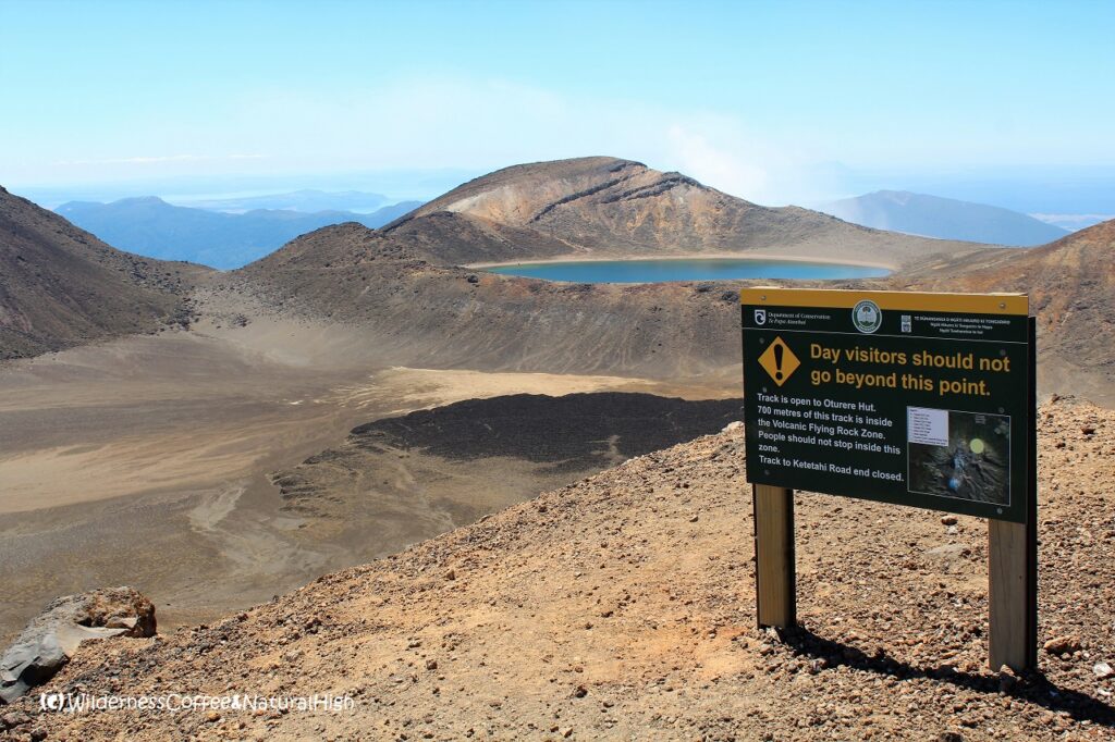 Volcanic flying rock zone, with the Blue Lake in the background. Tongariro Crossing, New Zealand.