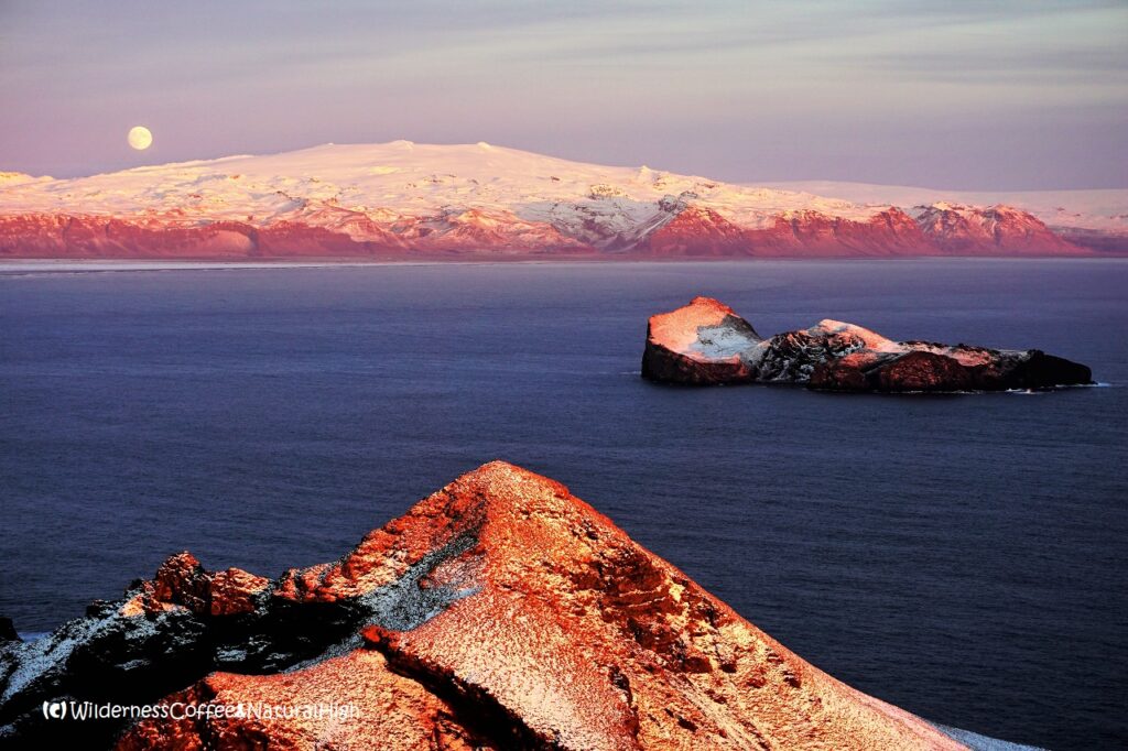 Winter moonrise above Eyjafjallajökull, seen from Vestmannaeyjar, Iceland.