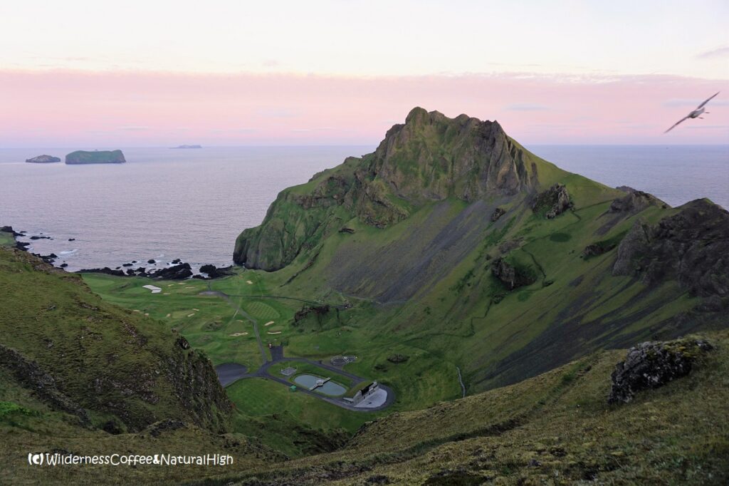 Zigzag path and view into Herjólfsdalur, Heimaey, Vestmannaeyjar, Iceland.