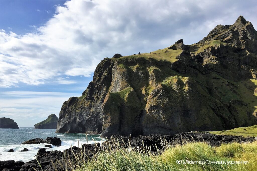 Dalfjall peaks and Elephant Rock, Heimaey, Vestmannaeyjar, Iceland.
