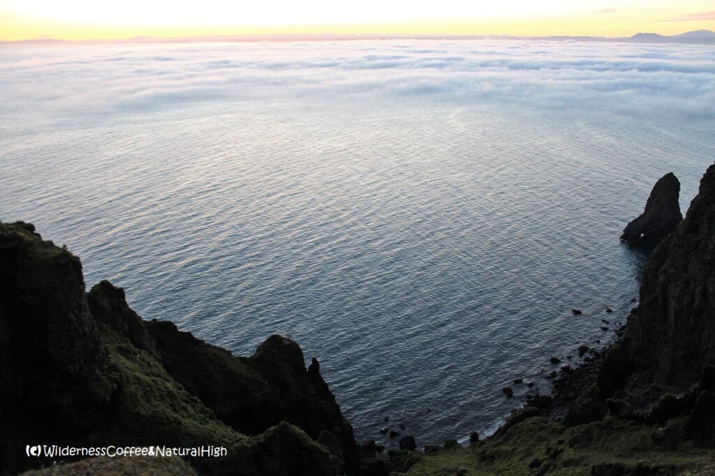 Distant sea fog rolling in Dalalæða moving in over the sea, Heimaey, Vestmannaeyjar, Iceland.