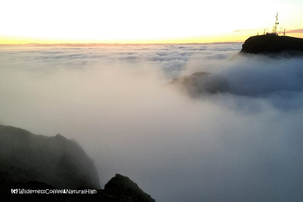 Klif swallowed by waterfalls of fog Waterfall of fog over Klif, Heimaey, Vestmannaeyjar, Iceland.
