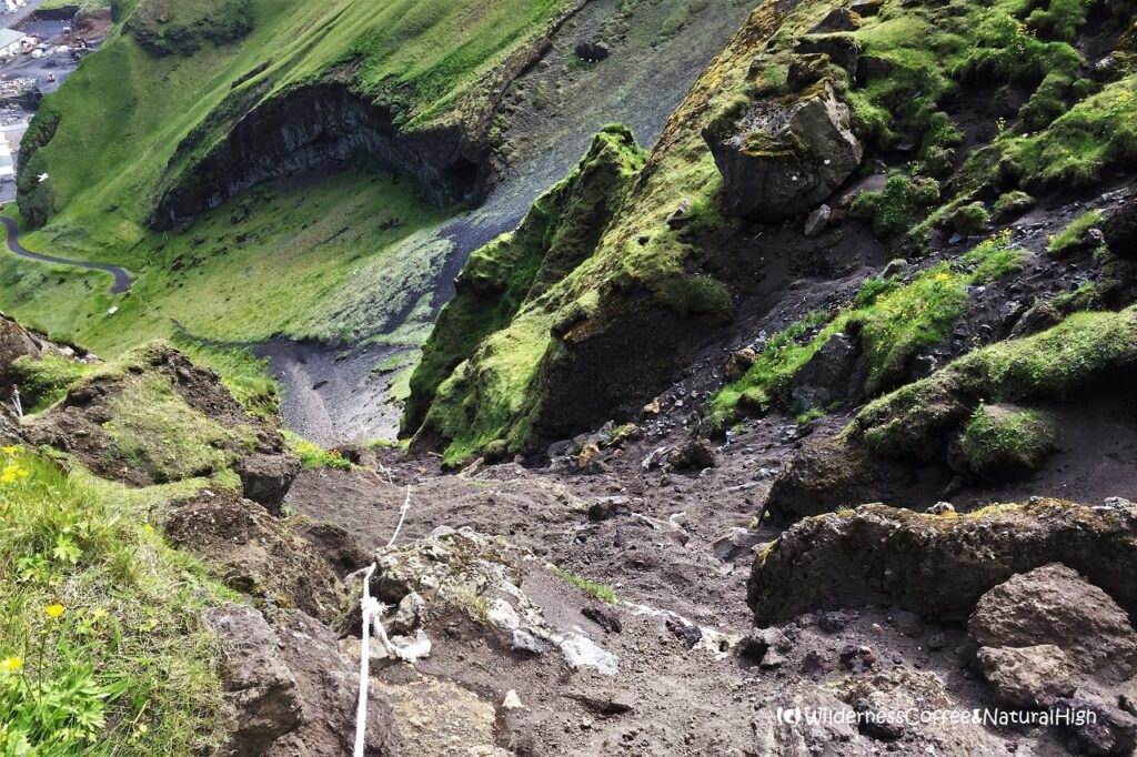 Looking down the slope Klif hike, ropes, Heimaey, Vestmannaeyjar, Iceland.