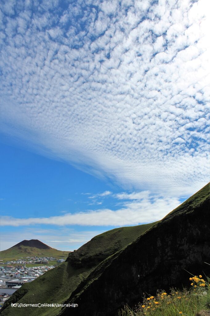 Beautiful wispy translucent clouds Helgafell volcano, wispy translucent clouds, Heimaey, Vestmannaeyjar, Iceland.