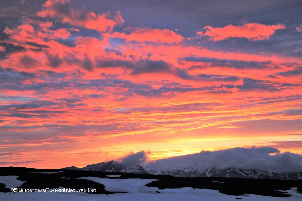 Midnight sunset and giant dalalæða Midnight sunset from Fimmvörðuháls hut, Eyjafjallajökull glacier, Iceland.