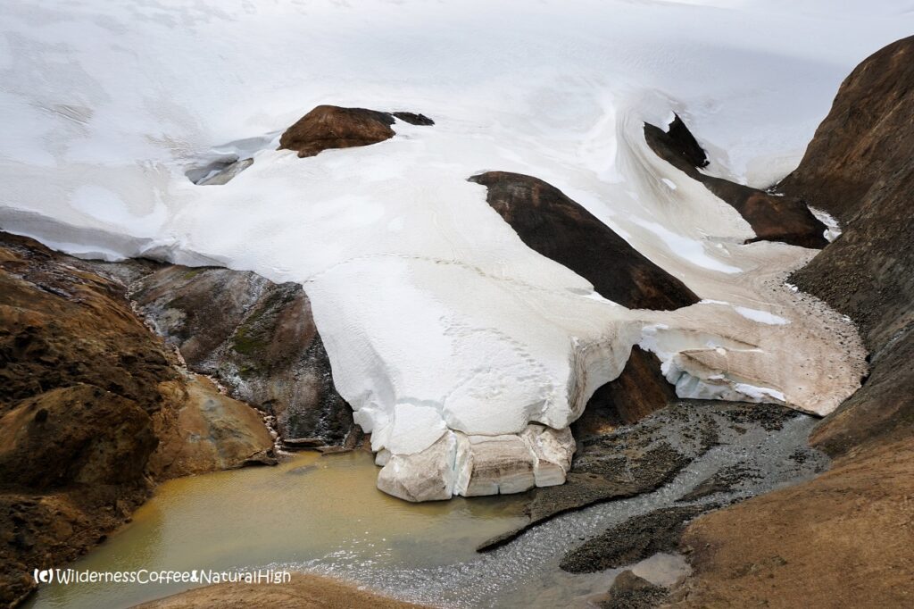 Ice dropping into the river, Hveradalir geothermal valley, Kerlingarfjöll, Iceland.
